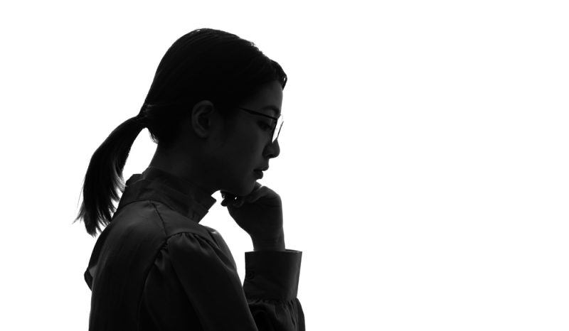 Silhouette of thinking asian woman profile.