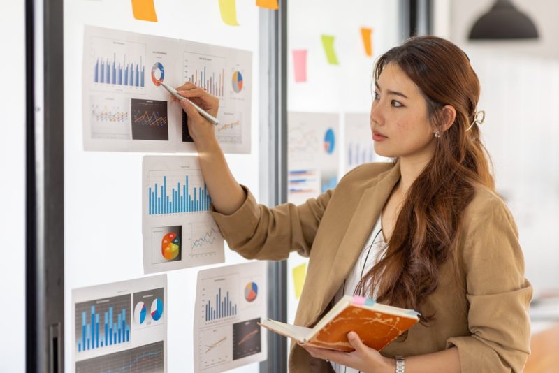 Young,Asian,Entrepreneur,Of,Small,Company,Putting,A,Adhesive,Sticky