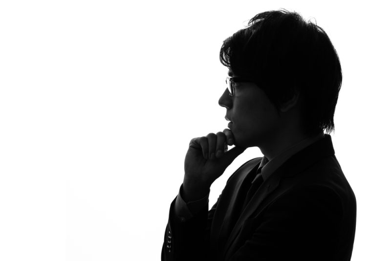Silhouette,Of,Thinking,Young,Asian,Businessman.